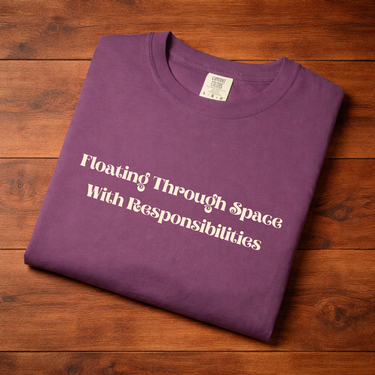 T-Shirt — "Floating Through Space With Responsibilities" Graphic Tee